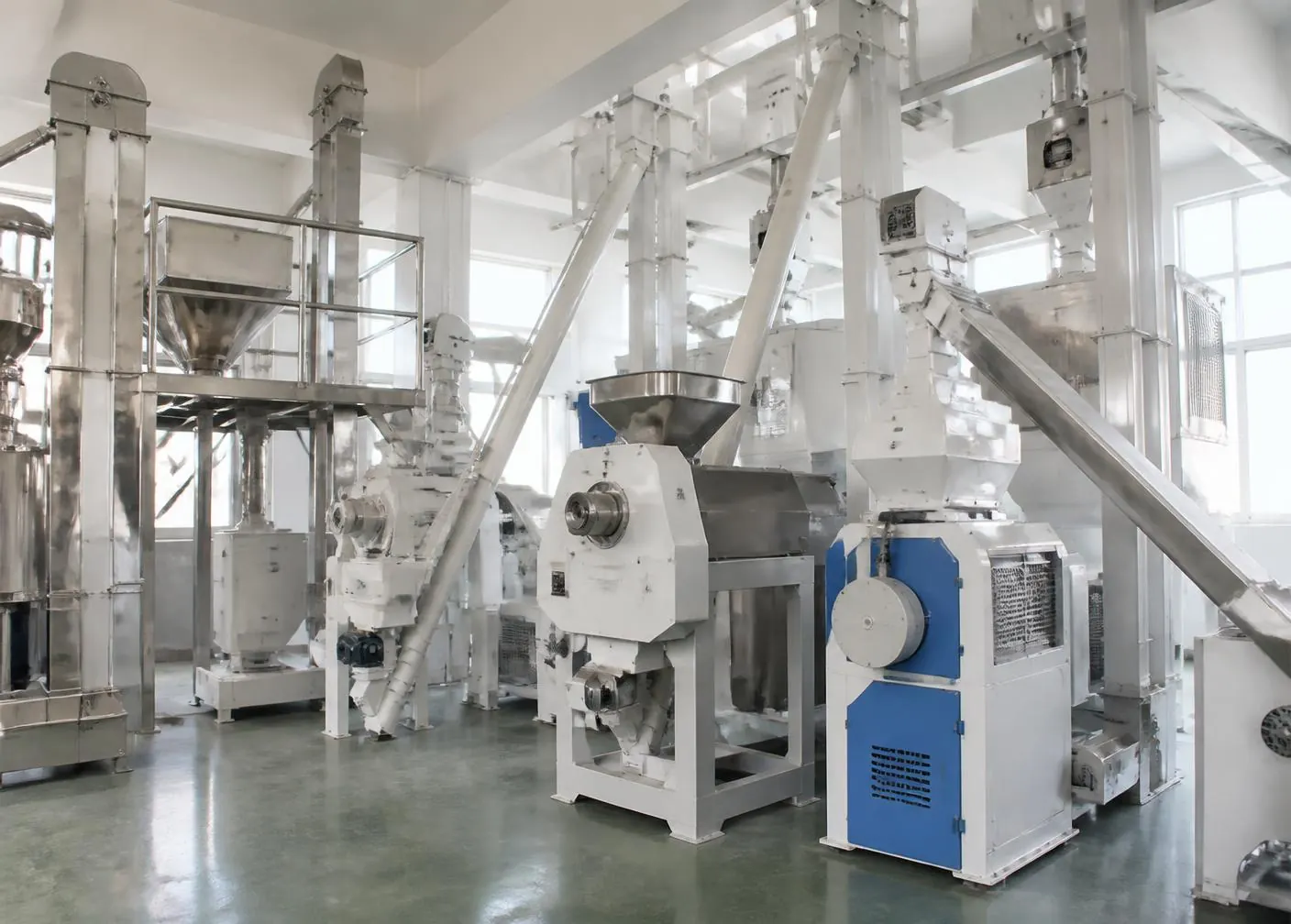 Commercial rice-processing equipment for cleaning and milling paddy rice inside a bright mill